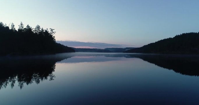 Aerial viev of  peaceful morning dawn, before sunrise over the lake in south Norway. (G&aring;sefl&aring;).