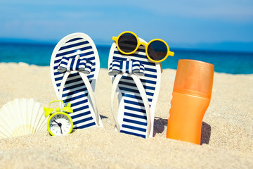 Fototapeta premium beautiful slippers in the sand of the sea in Greece background