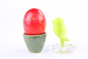 Onyx egg isolated green bird model on white background.