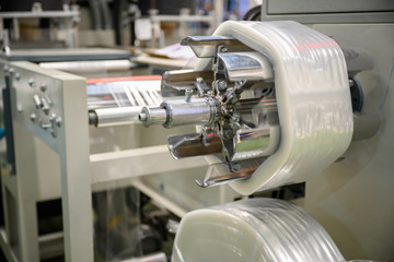 Plastic film making machine Polypropylene To make the bag Close-up storage in a roll In the concept of single use and the environment.