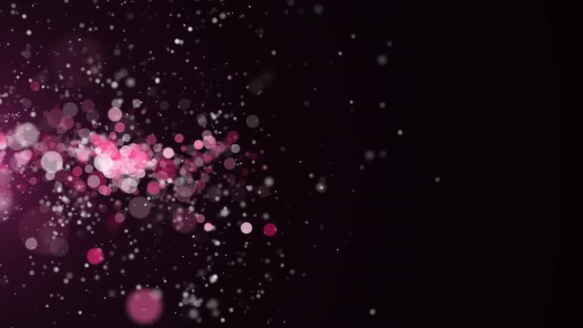 Pink glitter texture sparkles flying on dark background. 4k glittering footage. Abstract animation backdrop.