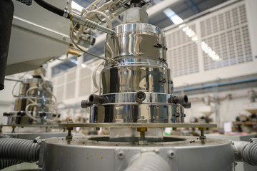 Plastic film bag making machine in the factory The close up of the die head In the concept of Save the world and the environment.
