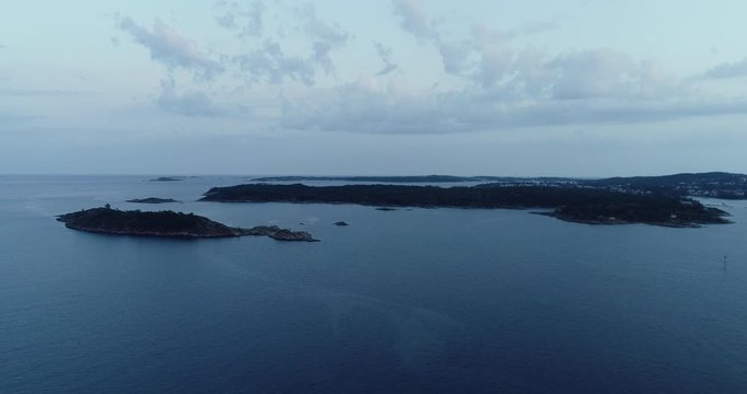 Aerial view of small islands in south Norway during cloudy morning.