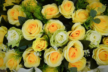 Fake flower and Floral background. rose flowers made of fabric. The fabric flowers bouquet. Colorful of decoration artificial flower