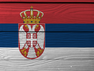 Serbia flag color painted on Fiber cement sheet wall background, fiber board texture background.