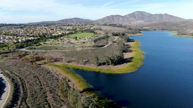 Aerial view of Otay Lake Reservoir with blue sky and mountain on the background, Chula Vista, California. USA