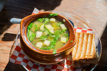 Close up of a bowl of hot vegetable soup