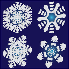 Set of christmas paper snowflakes on blue background.