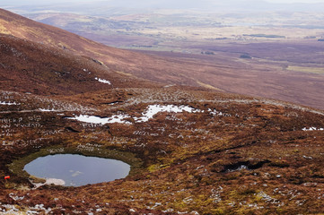 Names in stones on a mountaintop in Ireland