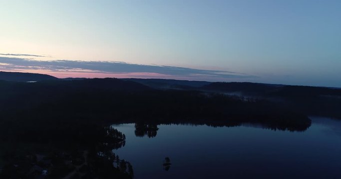 Aerial viev of  peaceful morning dawn, before sunrise over the lake in south Norway. (G&aring;sefl&aring;).