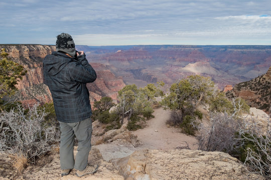 Photographer taking picture of the beautiful sunrise landscape of the Grand Canyon National Park
