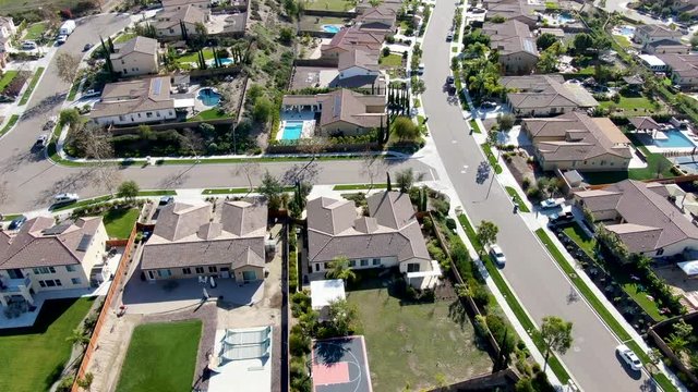 Aerial view of small neighborhood road with residential modern subdivision luxury houses in Chula Vista, California, USA.