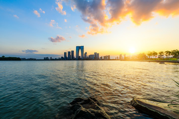 Naklejka premium Suzhou city skyline and water reflection at sunset.