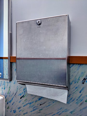 Paper towel dispenser in a public restroom.