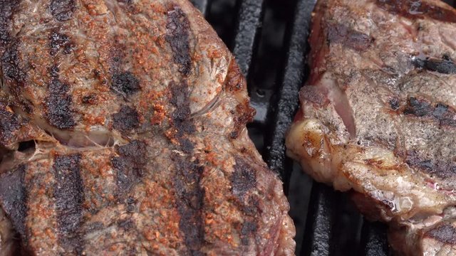 Close-up of Beef Steak being cooked on a BBQ