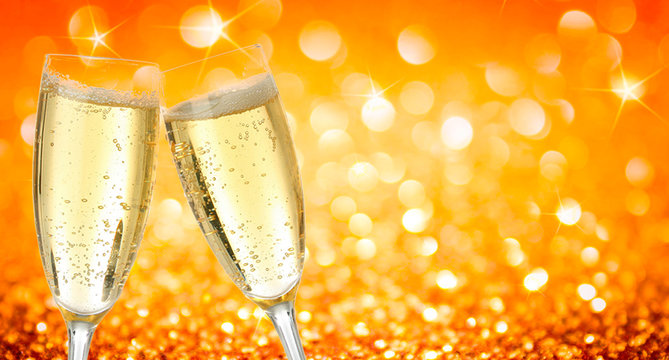 golden yellow bokeh light  background texture copy space  image with drink two champagne wine glasses luxury collided during the merry christmas happynewyear festival 2020 party in December winter
