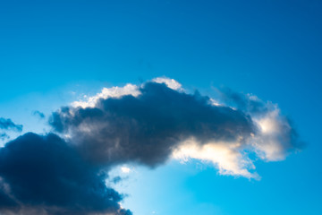 Obraz premium Blue sky with black clouds. Blue sky with white clouds