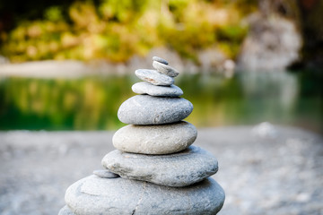 Fototapeta na wymiar Stones balance and wellness retro spa concept, peaceful and unique inspiration, zen-like and well being tranquil composition. Closeup of white pebbles stack over