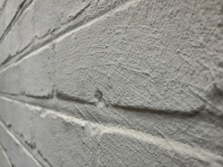 Gray Painted Concrete Wall Receding into Distance Background