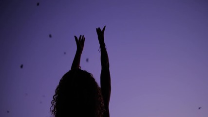 A Beautiful Woman Raising Her Hands To The Purple Sky Appreciating The Beauty Of Nature - Low Angle Shot