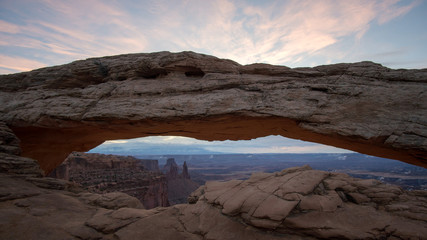 Mesa Arch during sunrise before the sun lights up the valley at dawn.