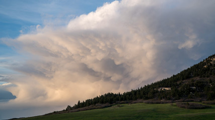 Mammatus clouds behind Bald Mountain at sunset in Colorado.