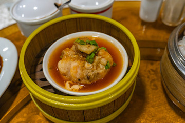 Chinese steamed meat ball and sauce in dimsum steamer box