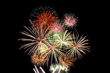 Fireworks light up in the night sky, dazzling scene.