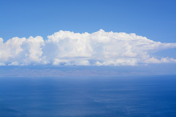 Big white clouds and the sea