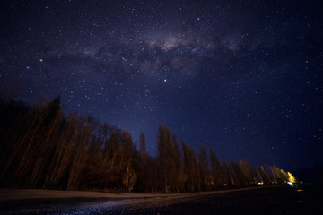 Fototapeta premium Amazing milky way view at Wanaka Lake,New Zealand.Image contain noise and soft focus due to long expose and High ISO