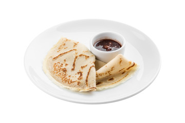 two thin pancakes with berry jam on the side isolated on white background