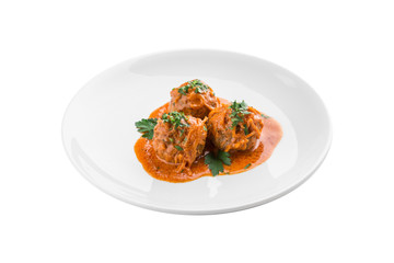 meatballs in tomato sauce on white plate isolated on white background