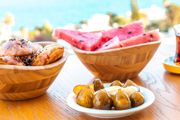 Breakfast on the beach at hotel or resort by the sea in summer season. Holiday and vacation breakfast image.Traditional Turkish or Greek breakfast at bodrum town beach in Turkey or Greece