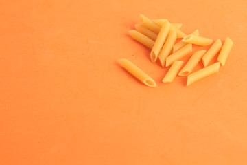 pasta raw feathers on colorful background