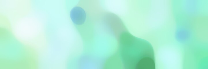 blurred iridescent horizontal background with pale turquoise, medium aqua marine and honeydew colors and space for text or image