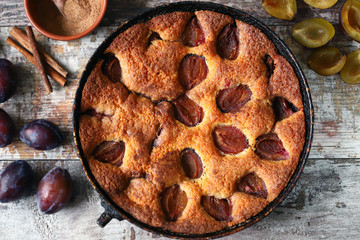 Homemade plum pie. Cooking plum cake. Selective focus. Macro.
