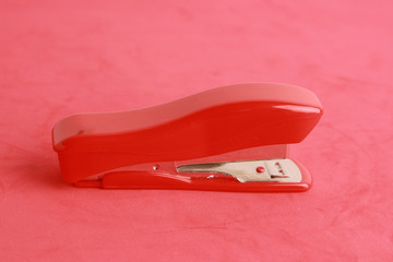 red stapler in color background