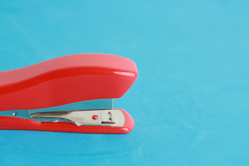 red stapler in color background