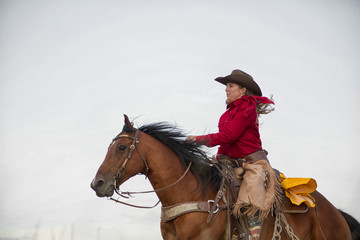 Obraz premium Cowgirl on Running Horse