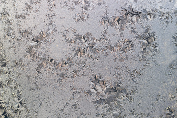 traces of frost on the window, a frozen window