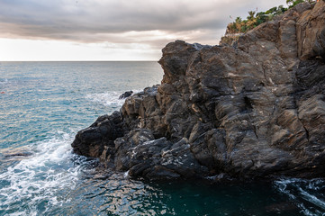 Fototapeta premium The splendid sea of the Five Lands in Manarola, Italy. A splendid seaside and fishing village, a popular tourist destination for seaside holidays immersed in unspoilt nature.