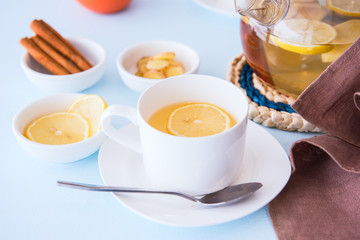 Obraz na płótnie Canvas Healthy herbal tea with ginger, lemon and cinnamon.