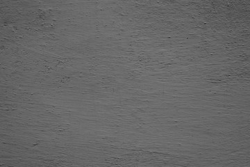 Texture of a concrete wall with cracks and scratches which can be used as a background