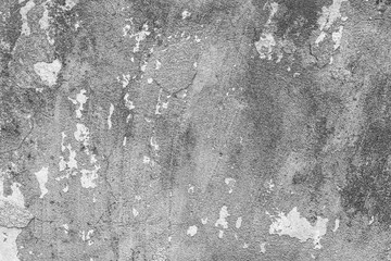Texture of a concrete wall with cracks and scratches which can be used as a background
