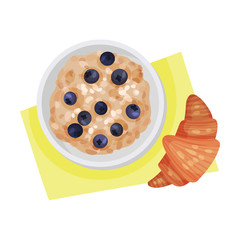 Bowl of Oatmeal Porridge and Blueberries Served with Croissant Resting Beside it Vector Illustration