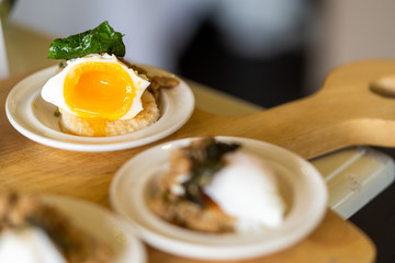 Poached egg on toasted bread. Catering.