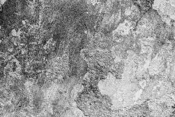 Texture of a concrete wall with cracks and scratches which can be used as a background