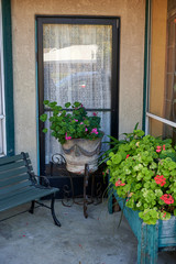 Fototapeta na wymiar small courtyard with bench and flowerbox