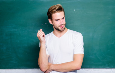 Master of simplification. Advantages for male elementary teacher are abundant. Teacher interesting speaker lecturer. Happy teachers day. Man teacher in front of chalkboard. Teaching could be more fun