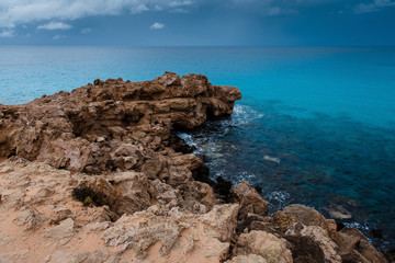 Fototapeta na wymiar Beautiful natural cliff and amazing turquoise sea on a Cape Greco, Cyprus